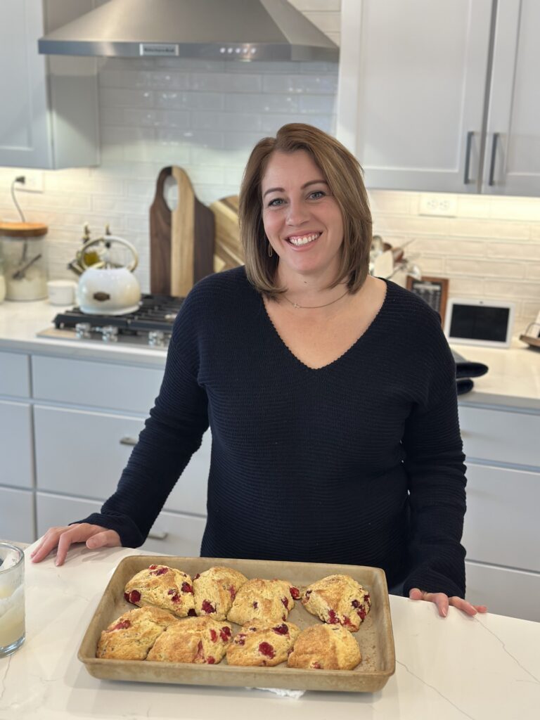 woman in kitchen smiling