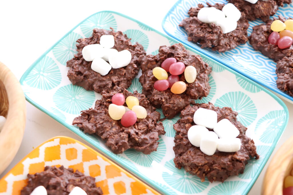 Chocolate Easter Egg Nests filled with jelly beans and marshmallows on a tray