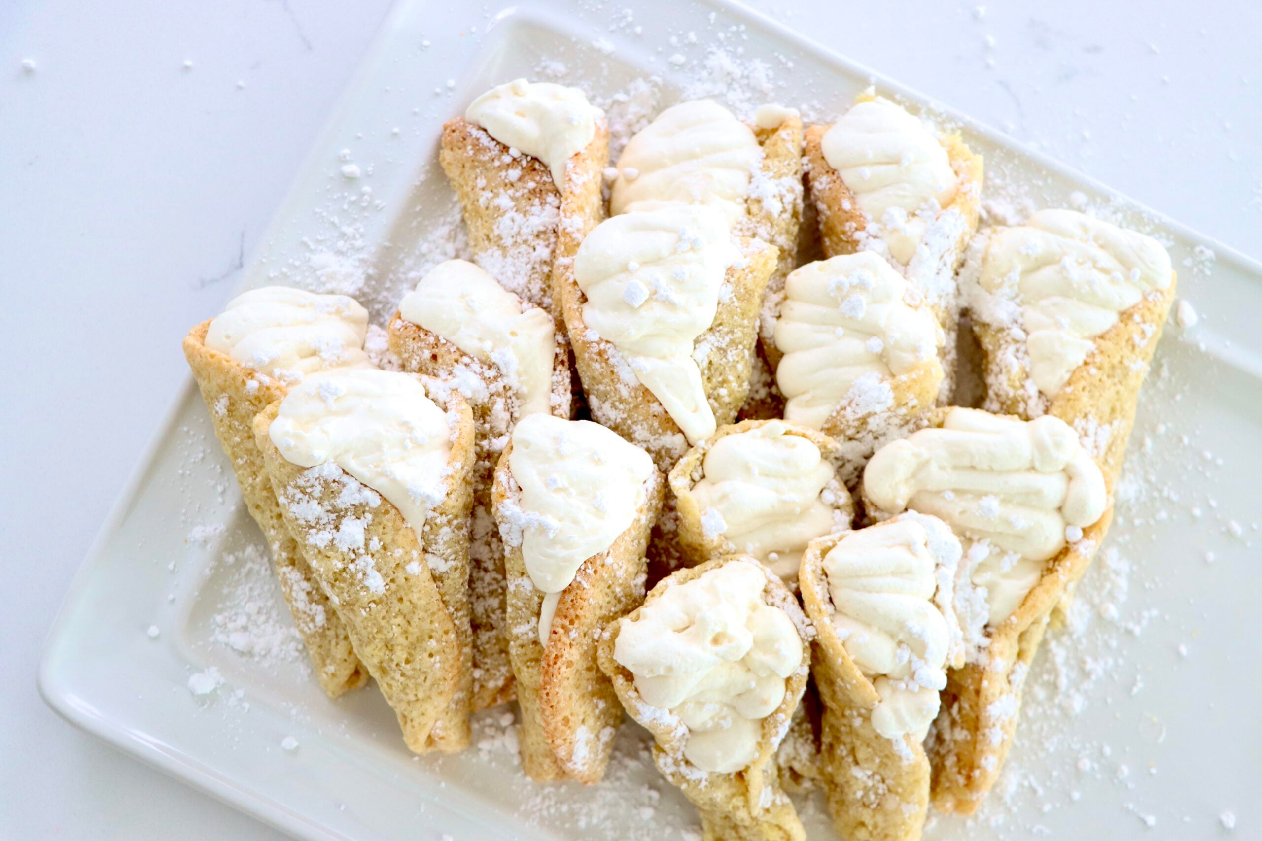 Easter Lily Dessert filled with whipped cream on a white tray
