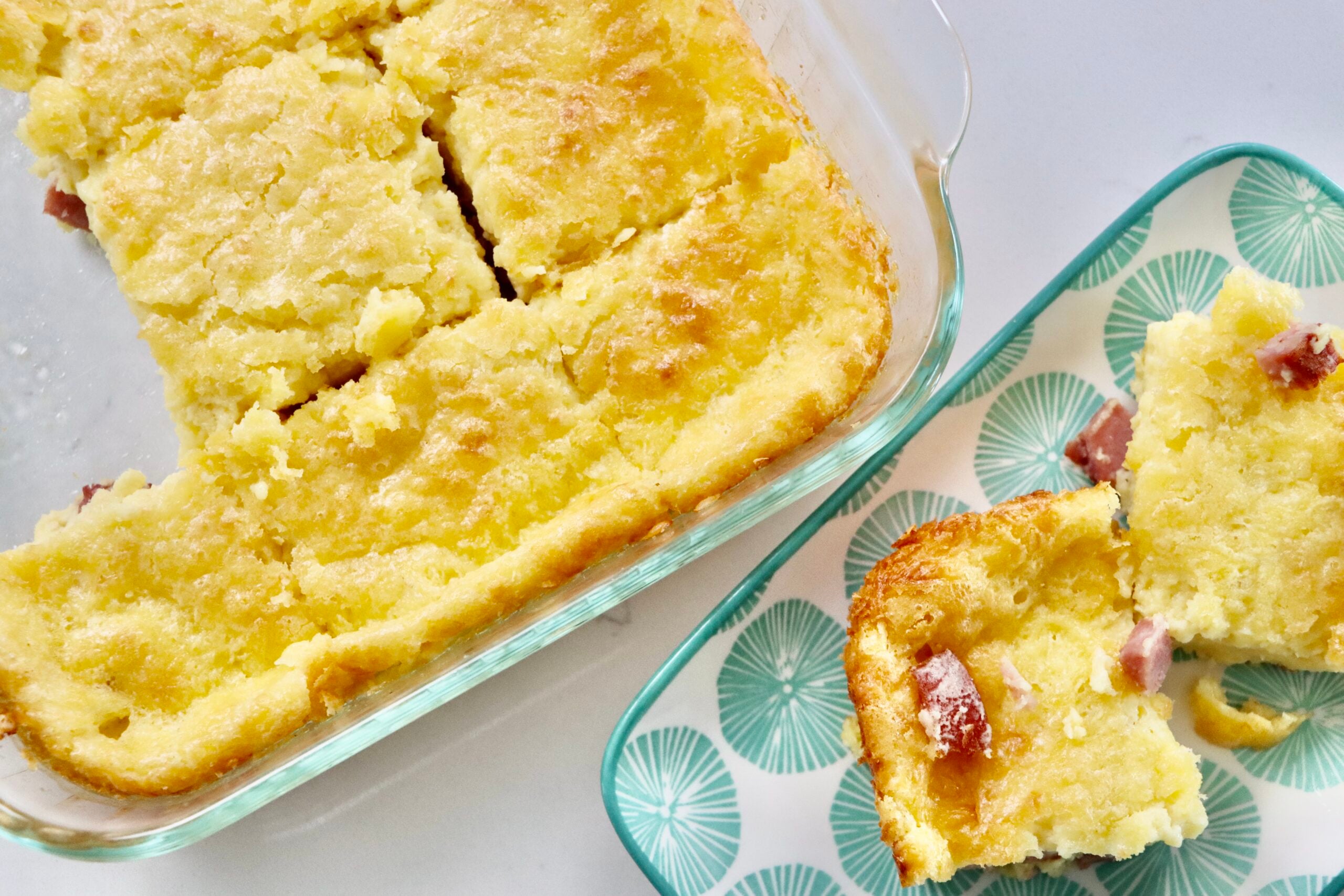 Crustless ham and cheese quiche in a pan and on a small plate