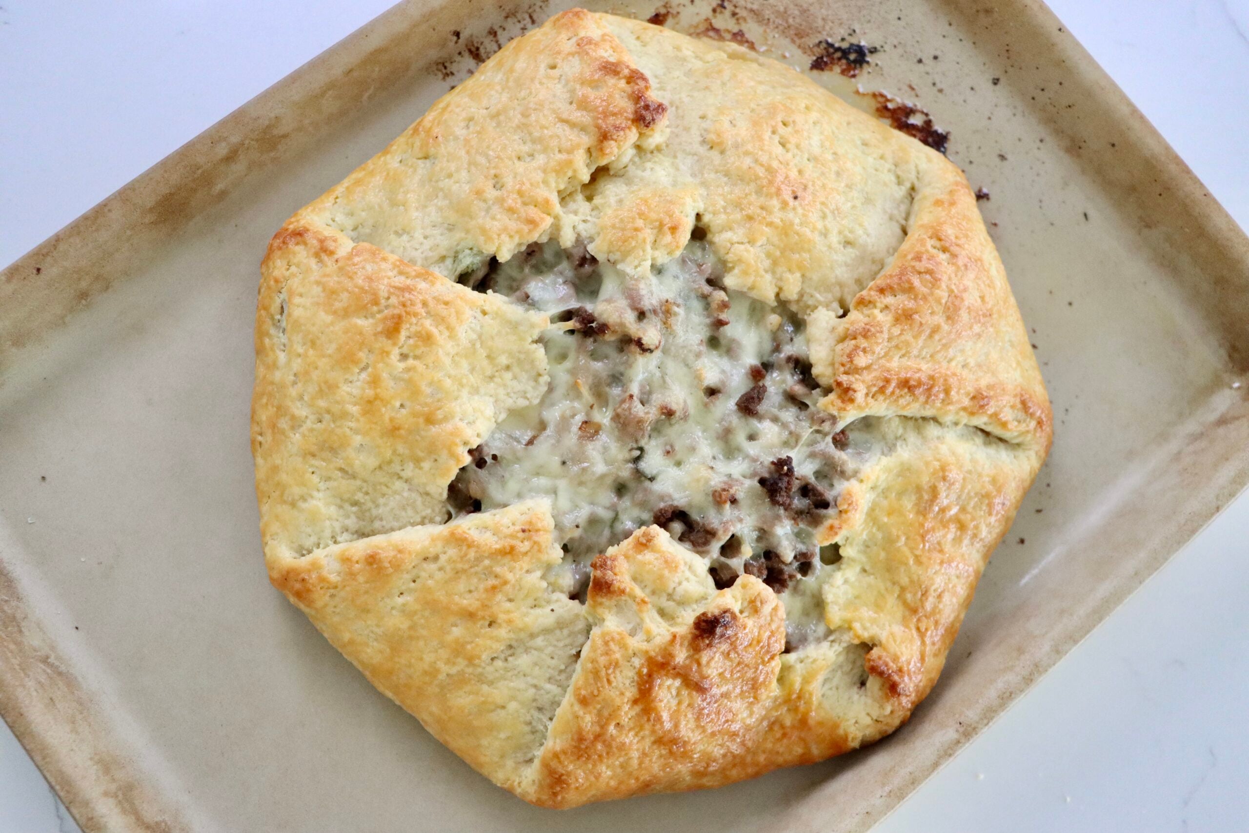 Beef Sweet Potato Sage Galette on a baking sheet