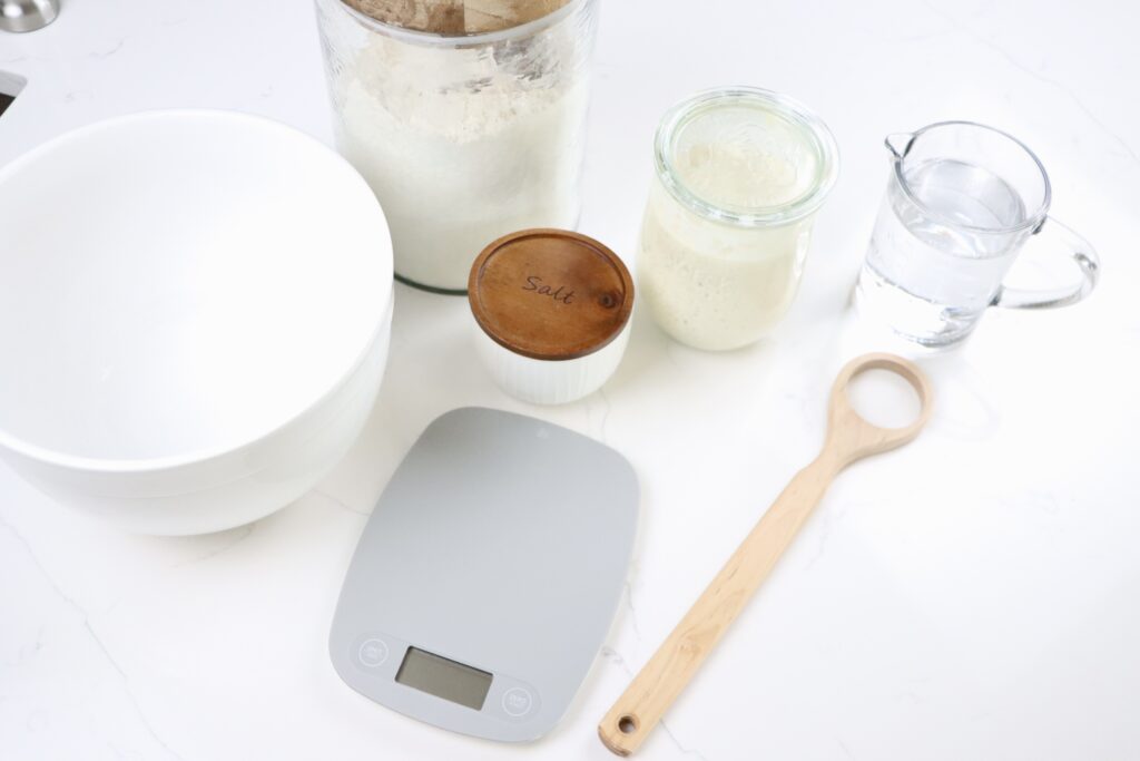 sourdough bread supplies - whisk, salt, flour, bowl and scale