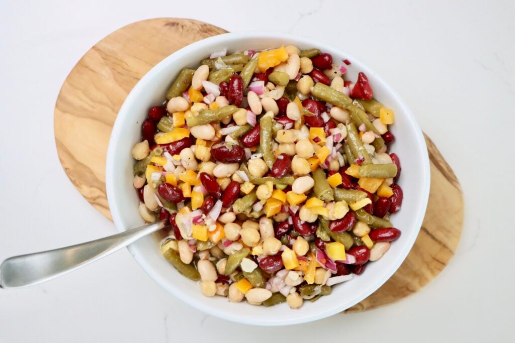 4 Bean Salad in a bowl on a cutting board