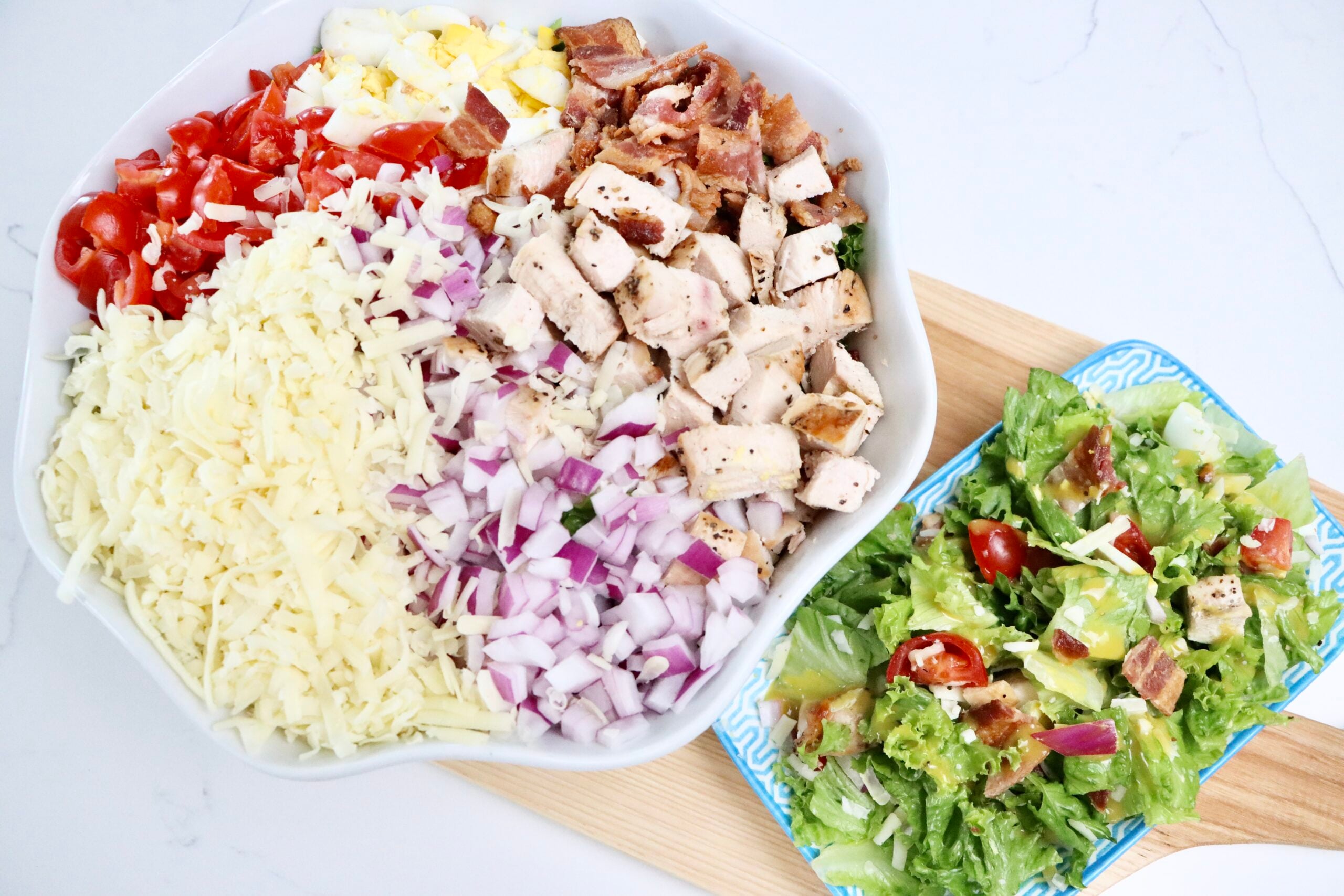Homemade Cobb Salad in a bowl and a plate