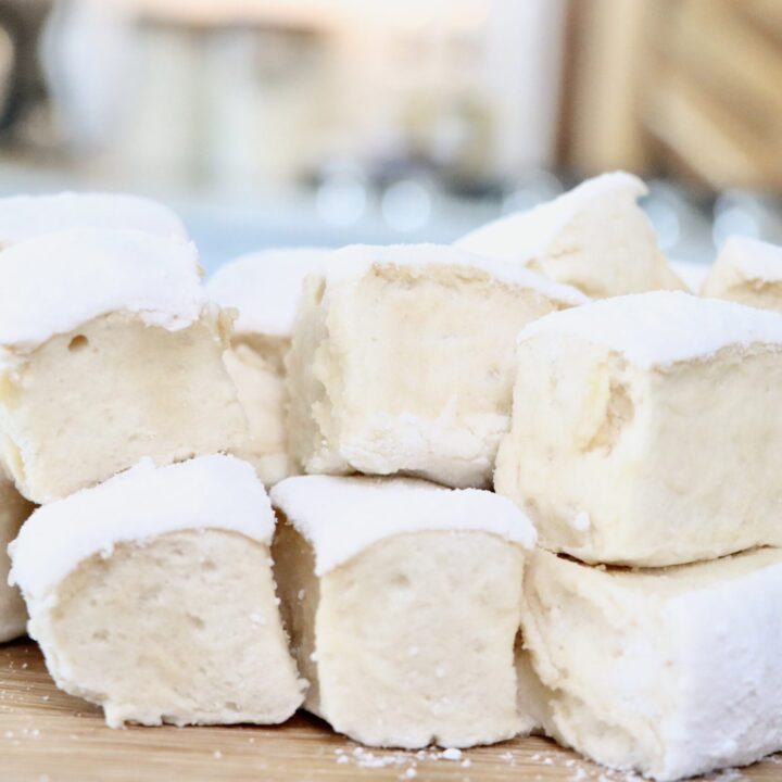 Fluffy homemade honey maple marshmallows cut into large squares, dusted with arrowroot and powdered sugar