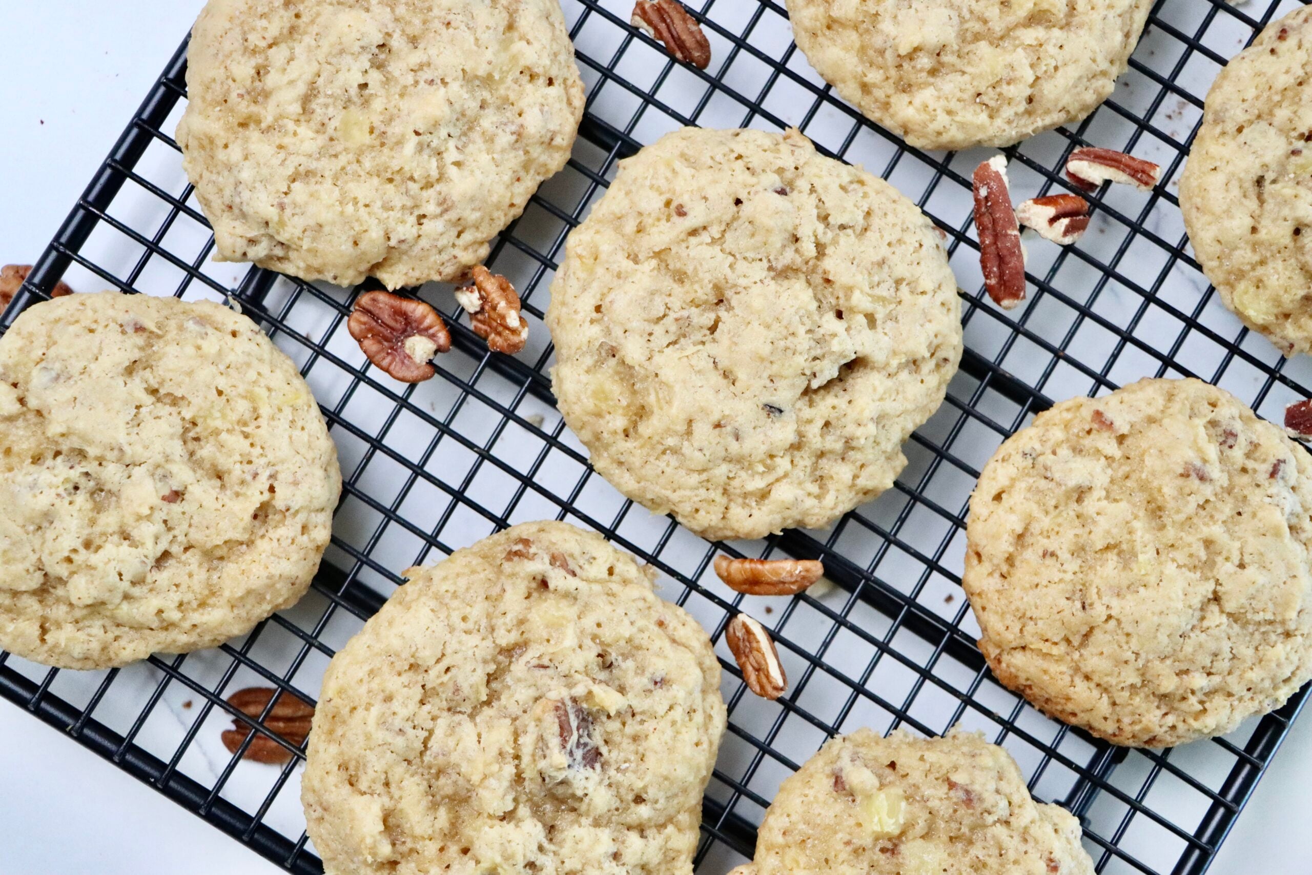 Pineapple Pecan Cookies on a cooling rack.