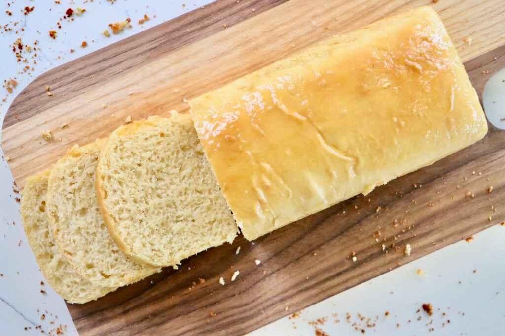 Soft and fluffy slices of sourdough Hawaiian bread showing airy texture and golden crust.
