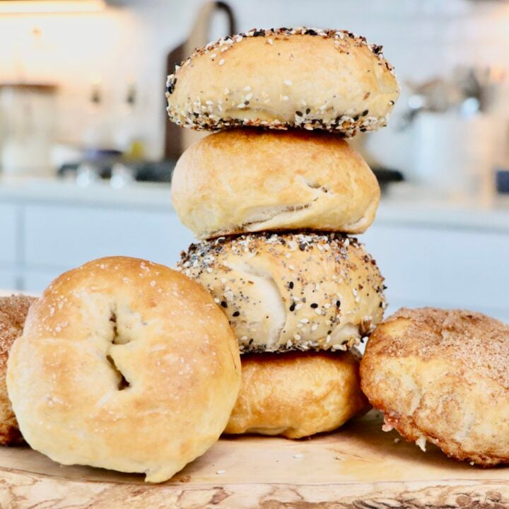 Golden brown homemade sourdough bagels fresh from the oven.