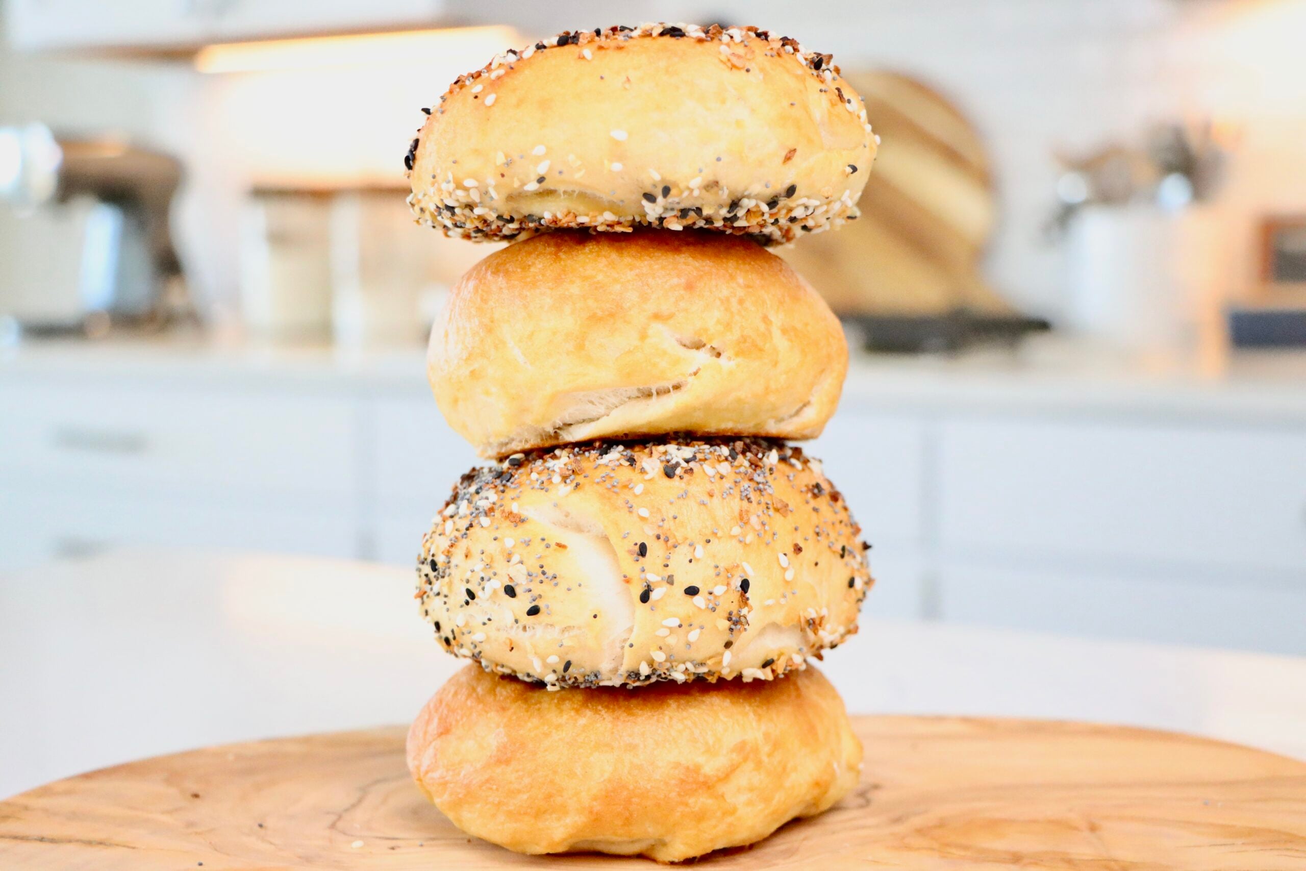 Golden brown homemade sourdough bagels fresh from the oven.