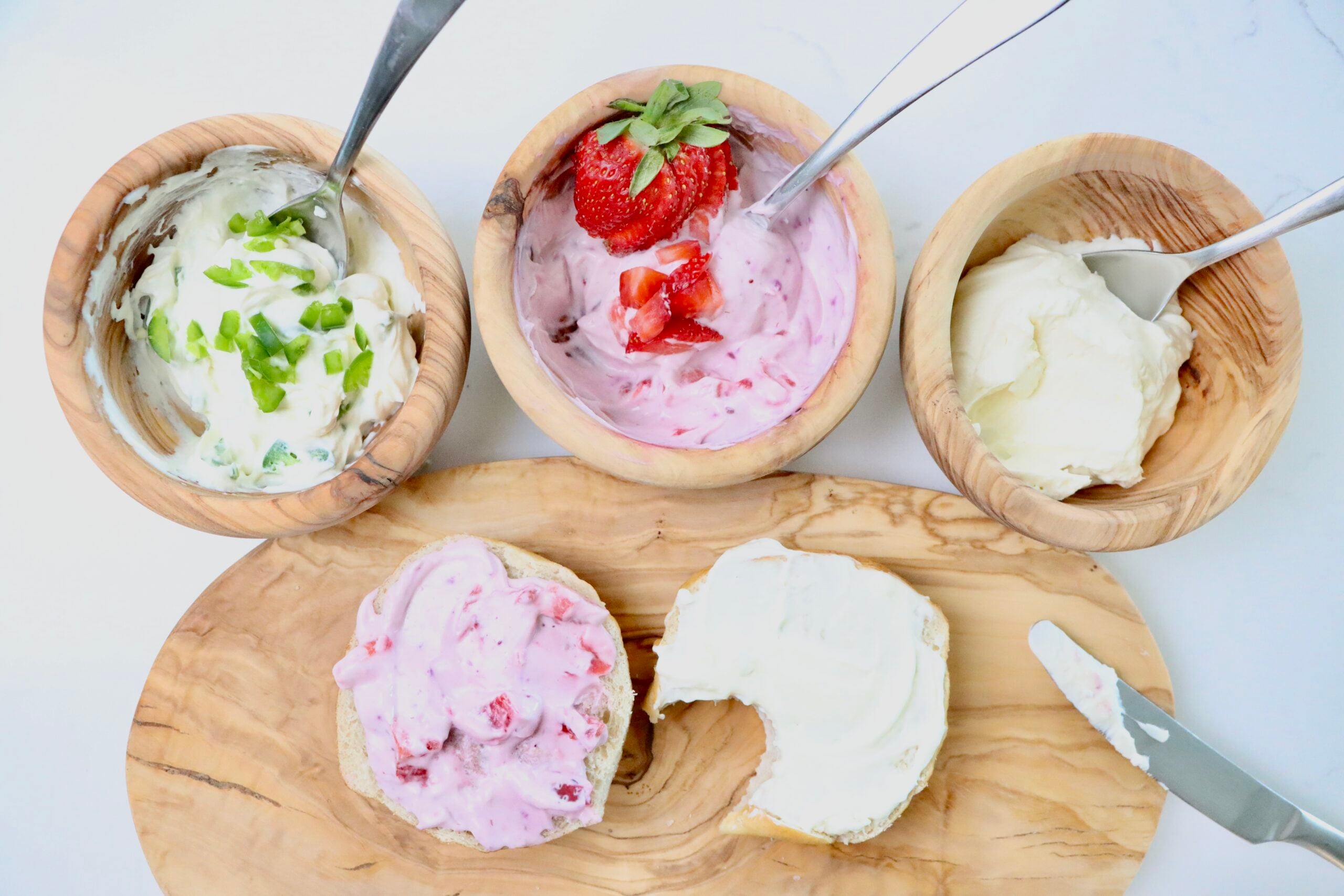 Light and fluffy homemade whipped cream cheese in a white bowl, perfect for bagels and toast