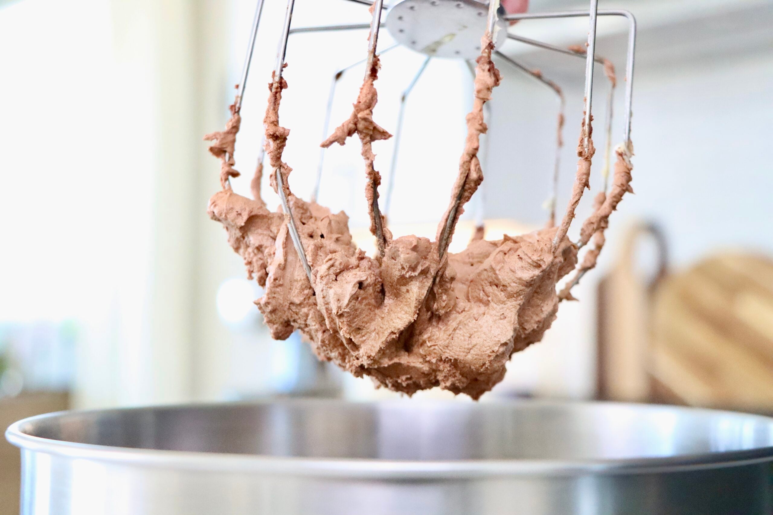 Chocolate Buttercream Frosting in a mixing beater