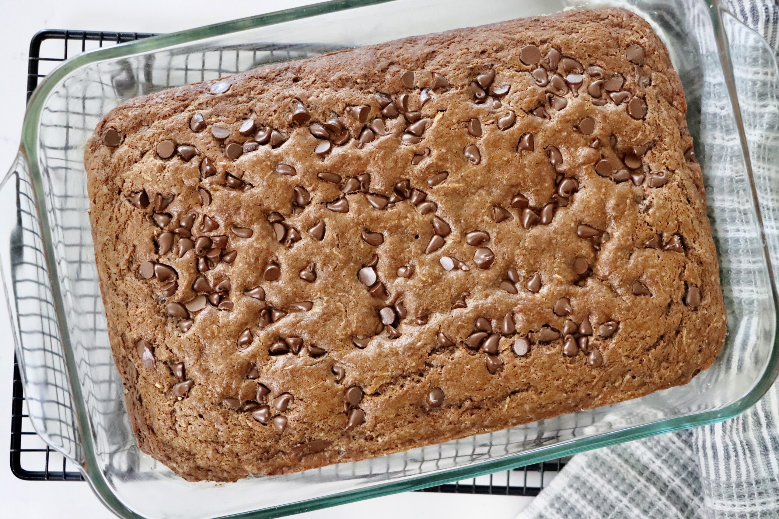 Moist Chocolate Zucchini Cake on a cooling rack