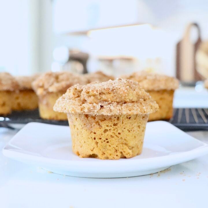A Pumpkin Spice Muffin on a white plate