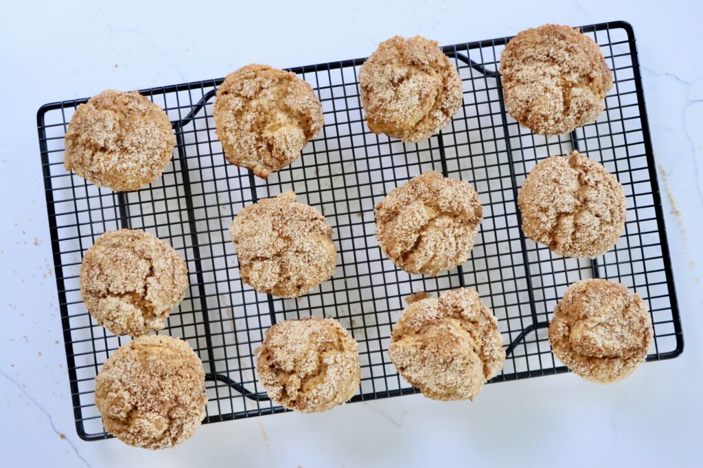 Pumpkin Spice Muffins on a black cooling rack.