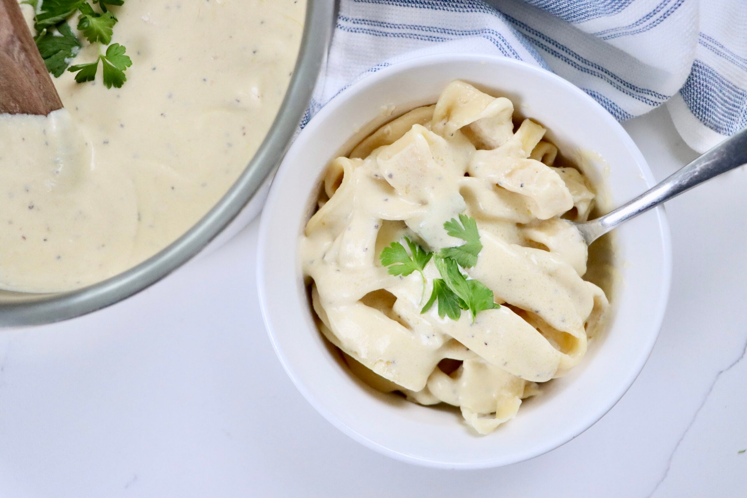 Easy homemade Alfredo sauce from scratch in a saucepan, thick and creamy, perfect for pasta, chicken, or shrimp dishes.
