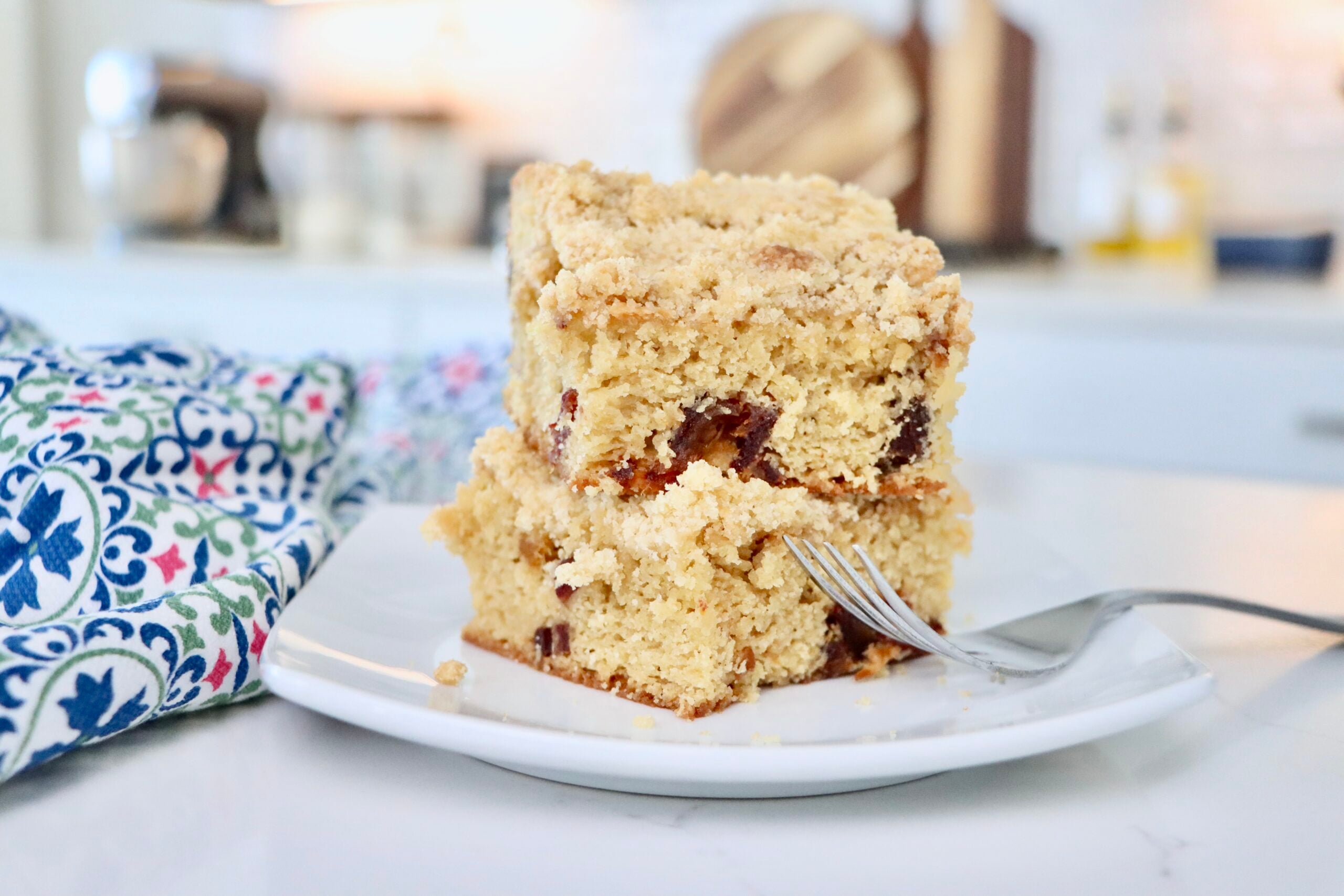 Homemade date coffee cake with chopped dates and soft tender crumb, fresh from the oven.