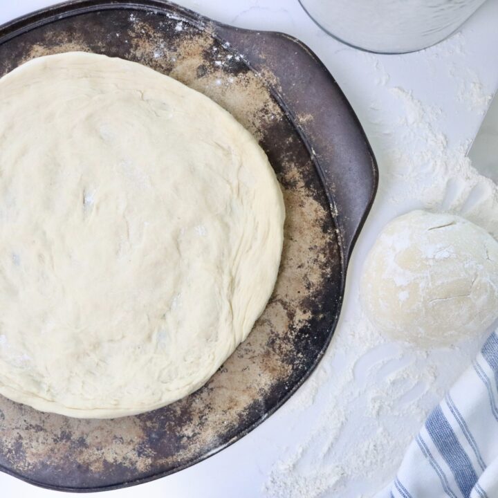 Fermented sourdough pizza dough resting and then shaped into homemade pizza crust