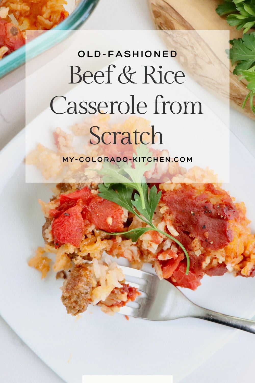 Close-up of Spanish-style beef and rice casserole showing layers of beef, rice, and tomatoes.