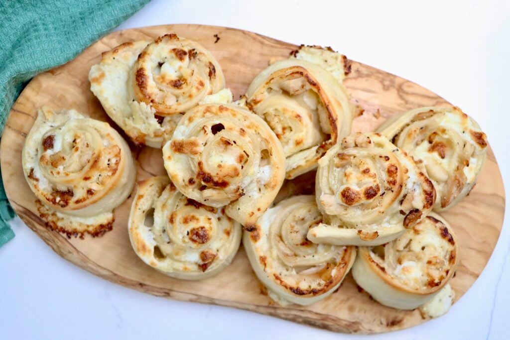 Golden sourdough chicken alfredo pizza rolls with melted mozzarella and parmesan cheese, baked to perfection.