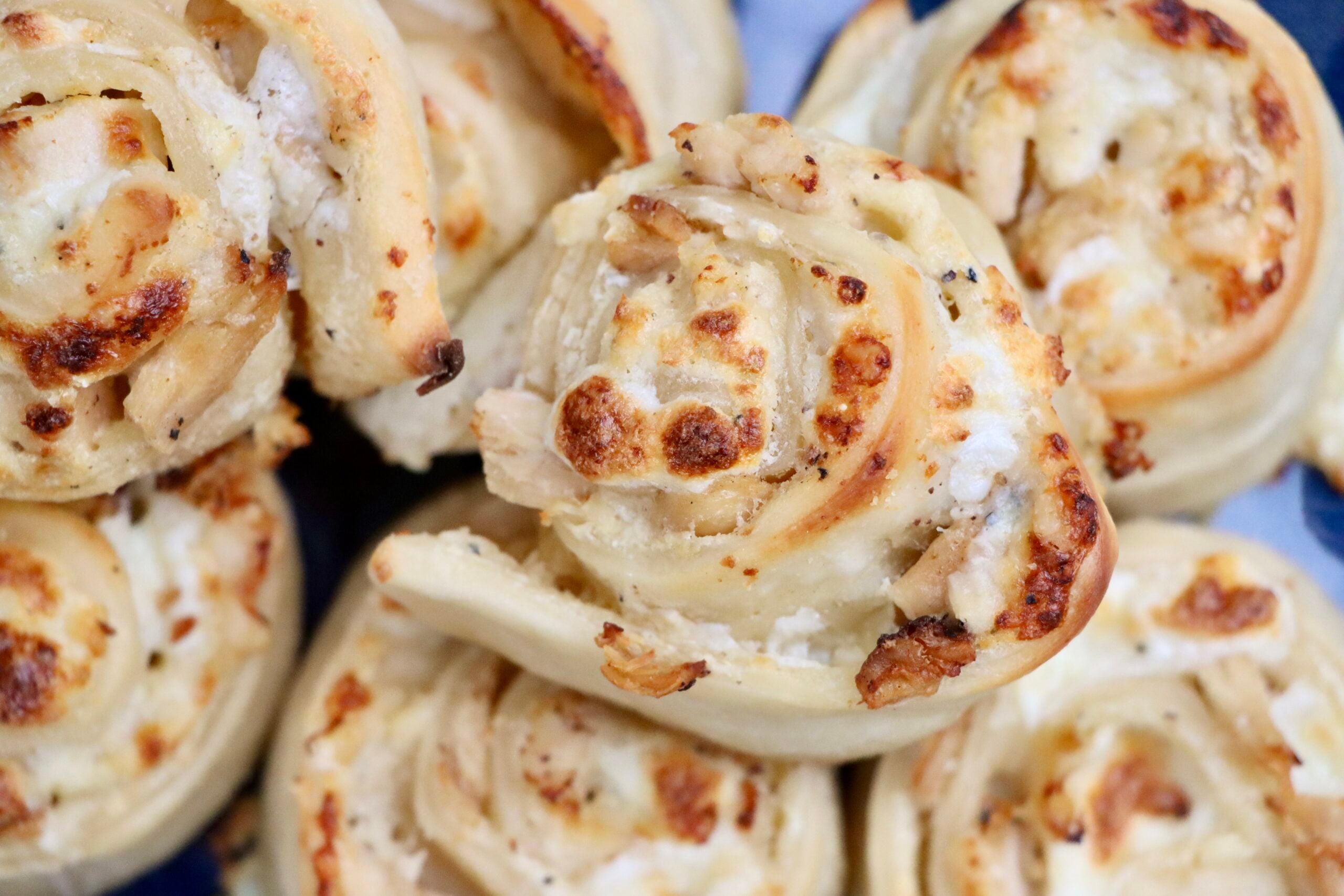 Golden sourdough chicken alfredo pizza rolls with melted mozzarella and parmesan cheese, baked to perfection.