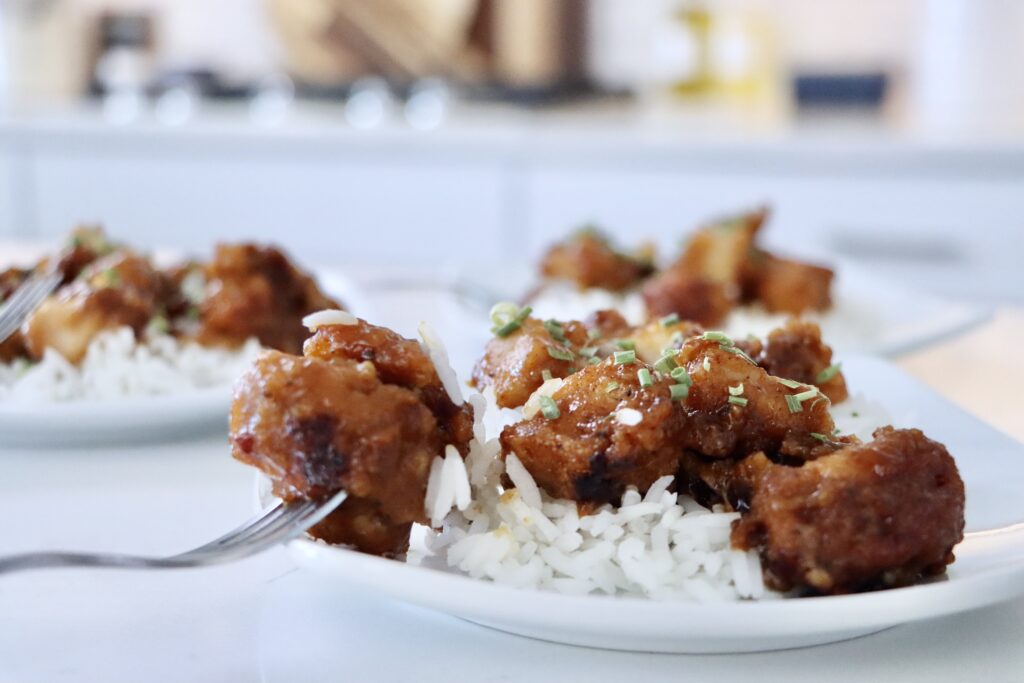 Crispy healthy orange chicken served over fluffy jasmine rice made from scratch with real ingredients