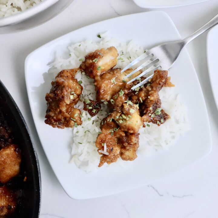 Crispy healthy orange chicken served over fluffy jasmine rice made from scratch with real ingredients
