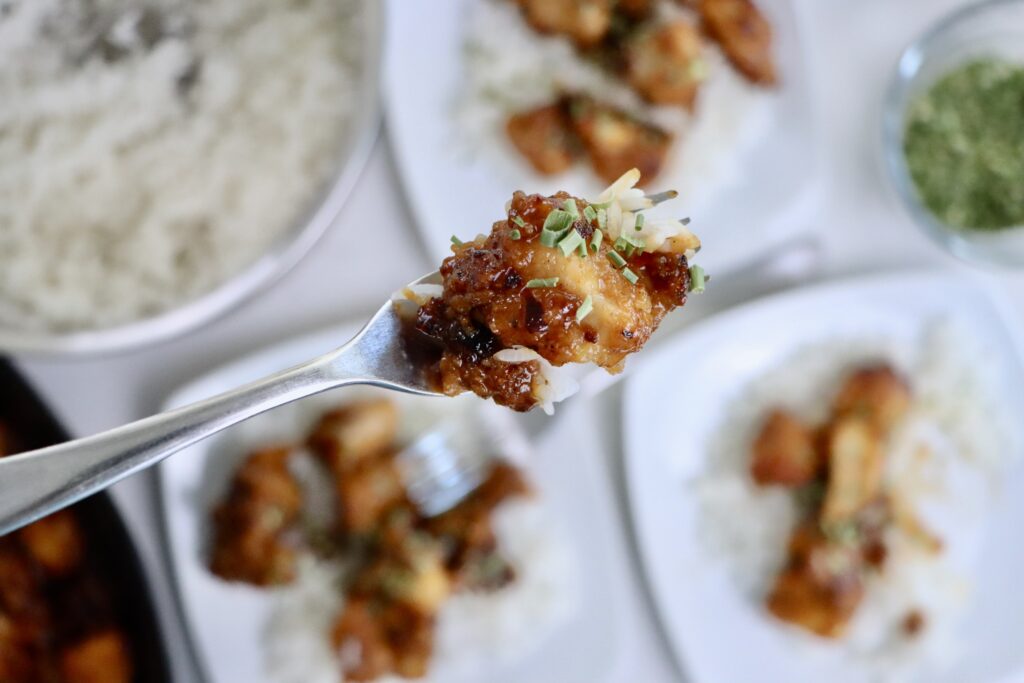 Crispy healthy orange chicken served over fluffy jasmine rice made from scratch with real ingredients