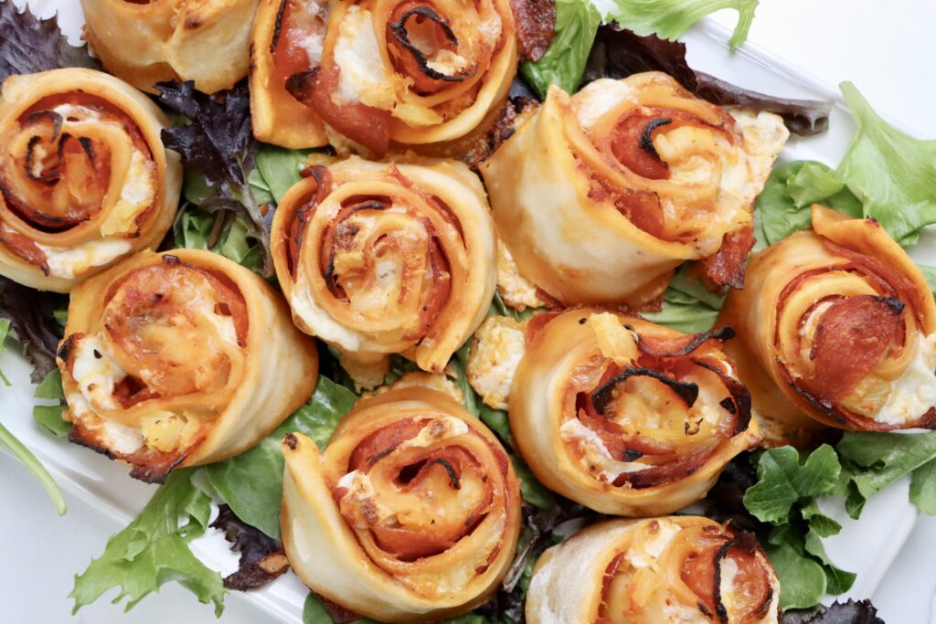 Sourdough pepperoni pizza rolls baked until golden brown with melted cheese on top