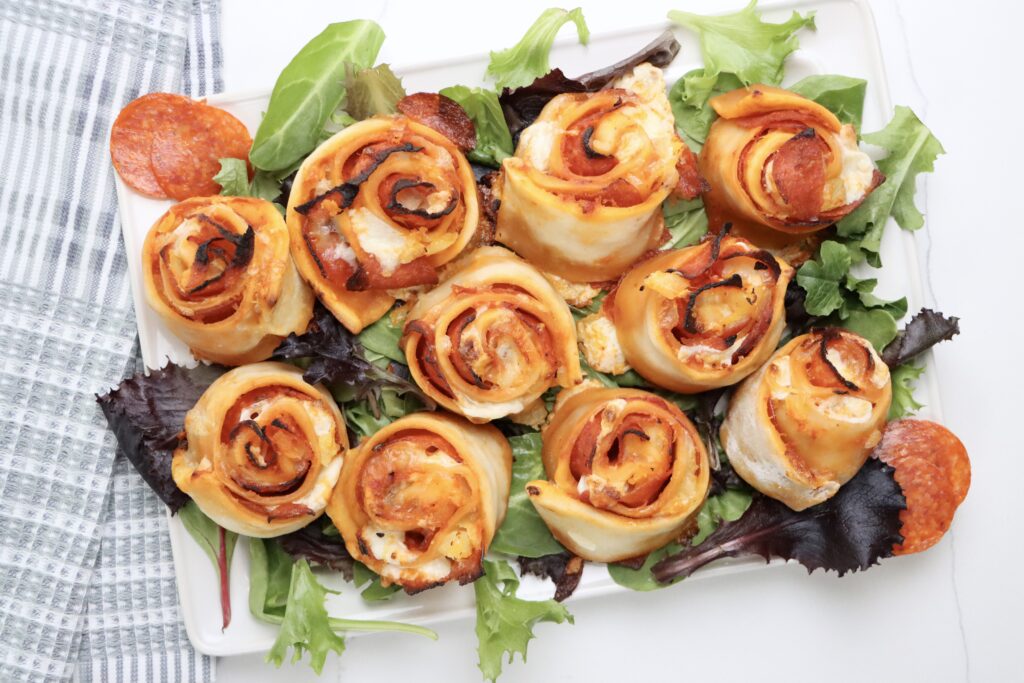 Sourdough pepperoni pizza rolls baked until golden brown with melted cheese on top