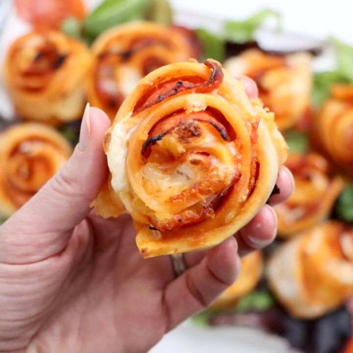 A close up of a Sourdough pepperoni pizza rolls baked until golden brown with melted cheese on top