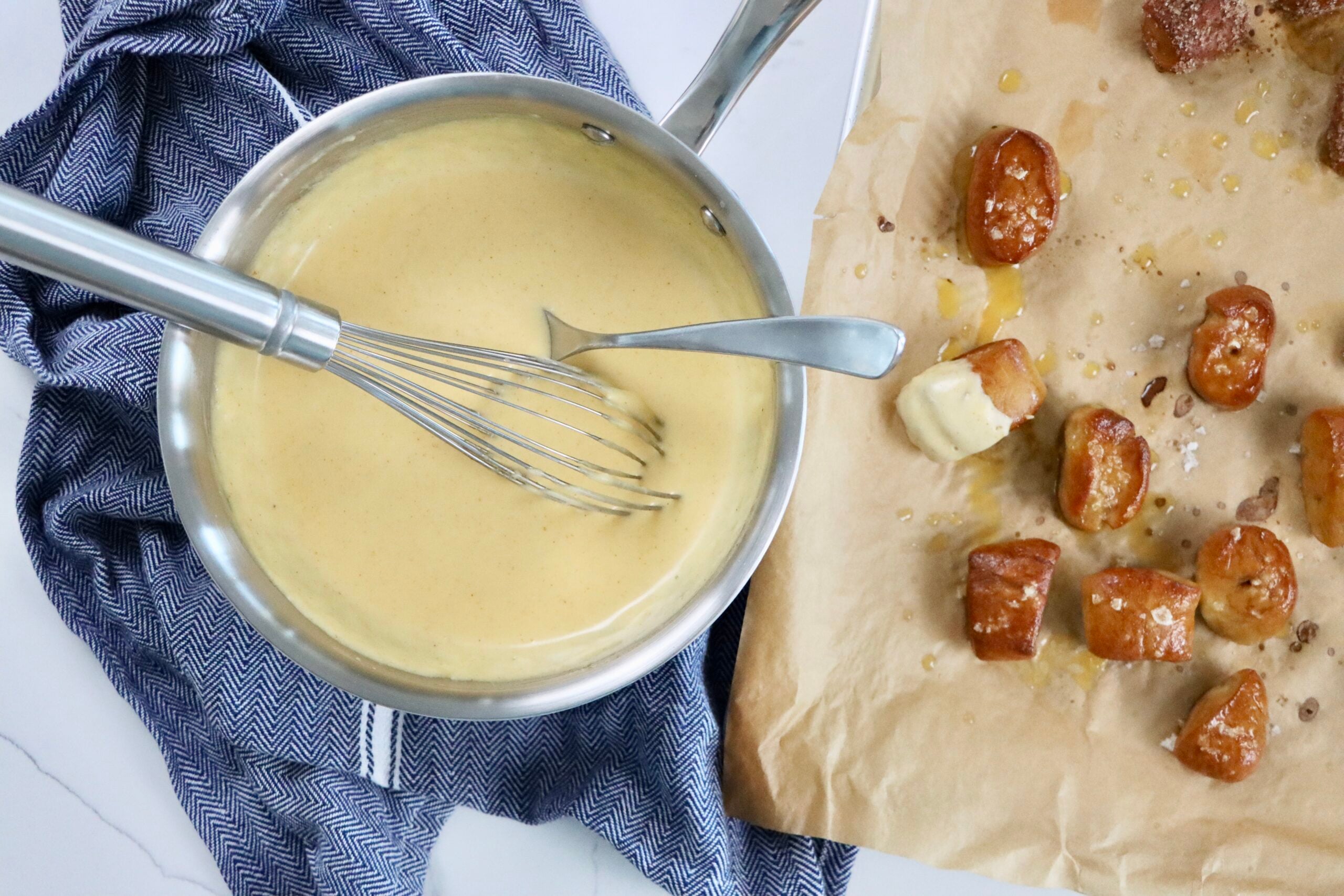 Homemade cheese dipping sauce made from scratch using real ingredients, perfect for pretzels or fries.