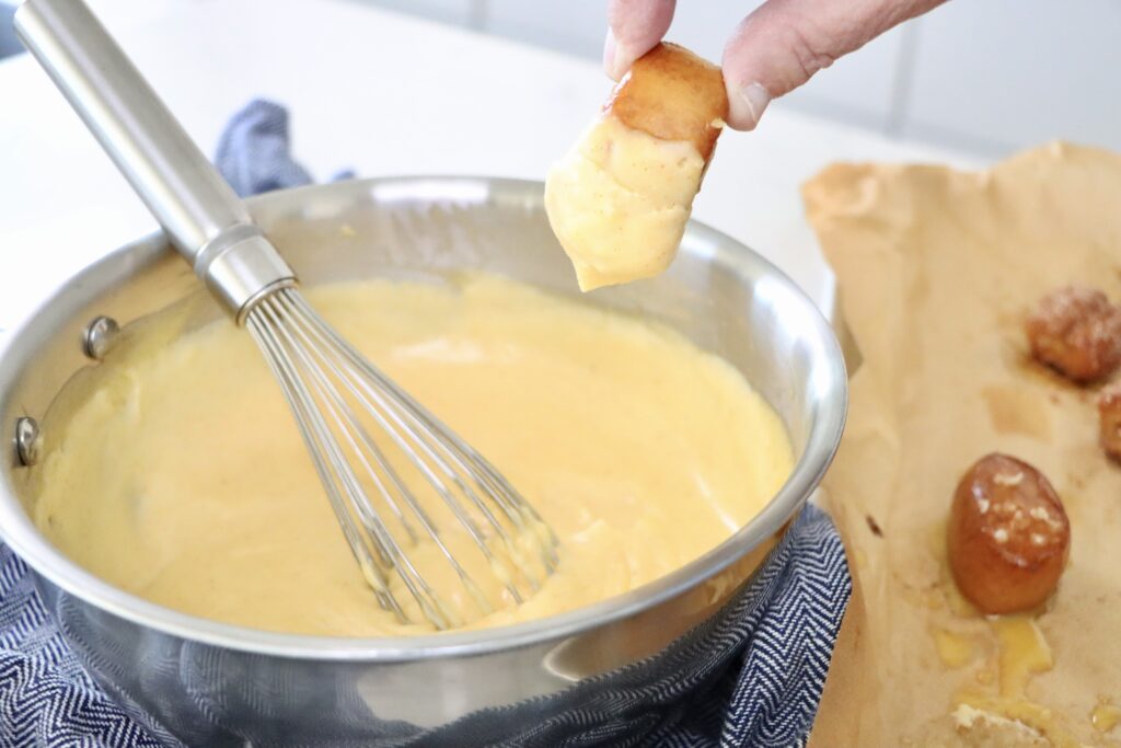 Homemade cheese dipping sauce made from scratch using real ingredients, perfect for pretzels or fries.