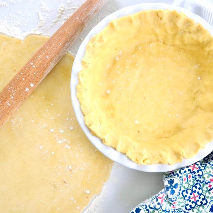 Golden flaky sourdough pie crust ready for baking, made with real butter and sourdough starter