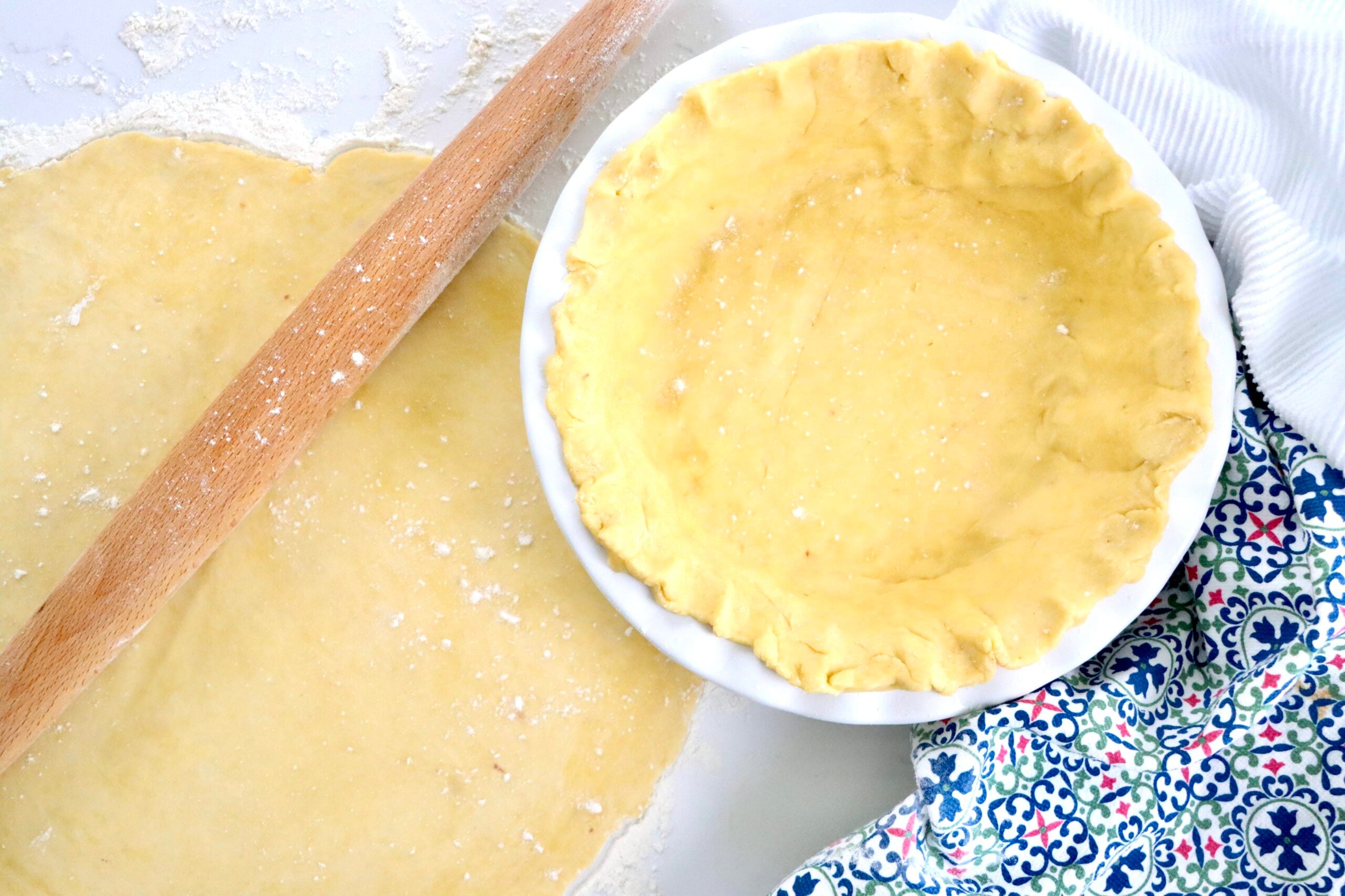 Golden flaky sourdough pie crust ready for baking, made with real butter and sourdough starter
