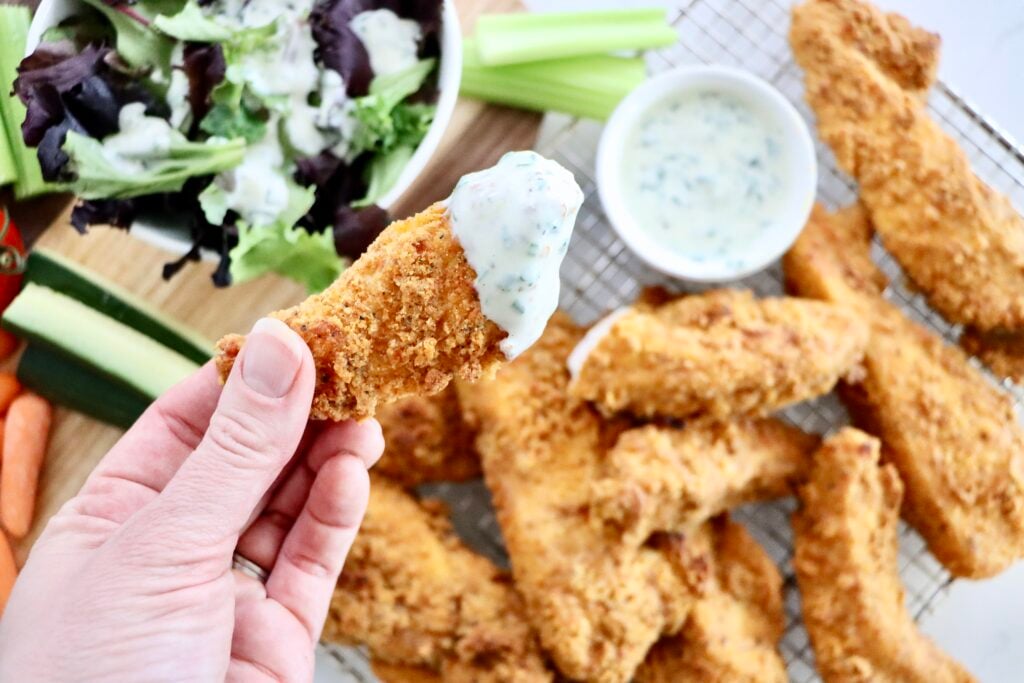 Close up of crispy baked chicken tenders showing the crunchy coating.