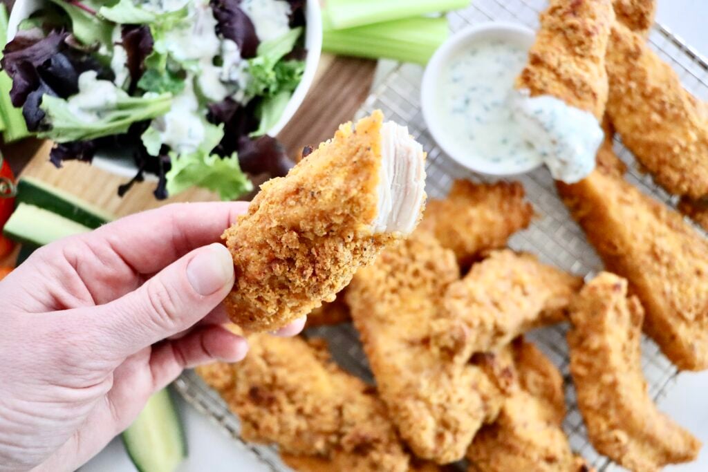 Close up of crispy baked chicken tenders showing the crunchy coating.