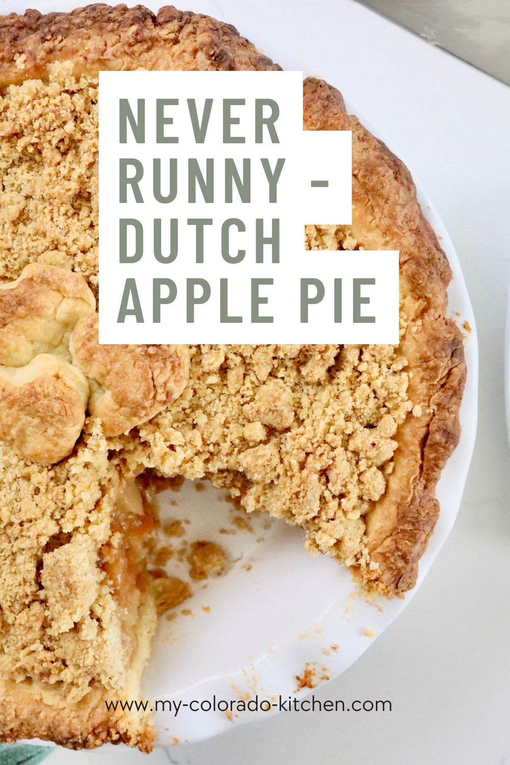 Close Up of a Homemade Dutch Apple Pie with golden crumb topping and thick cinnamon apple filling, fresh from the oven.