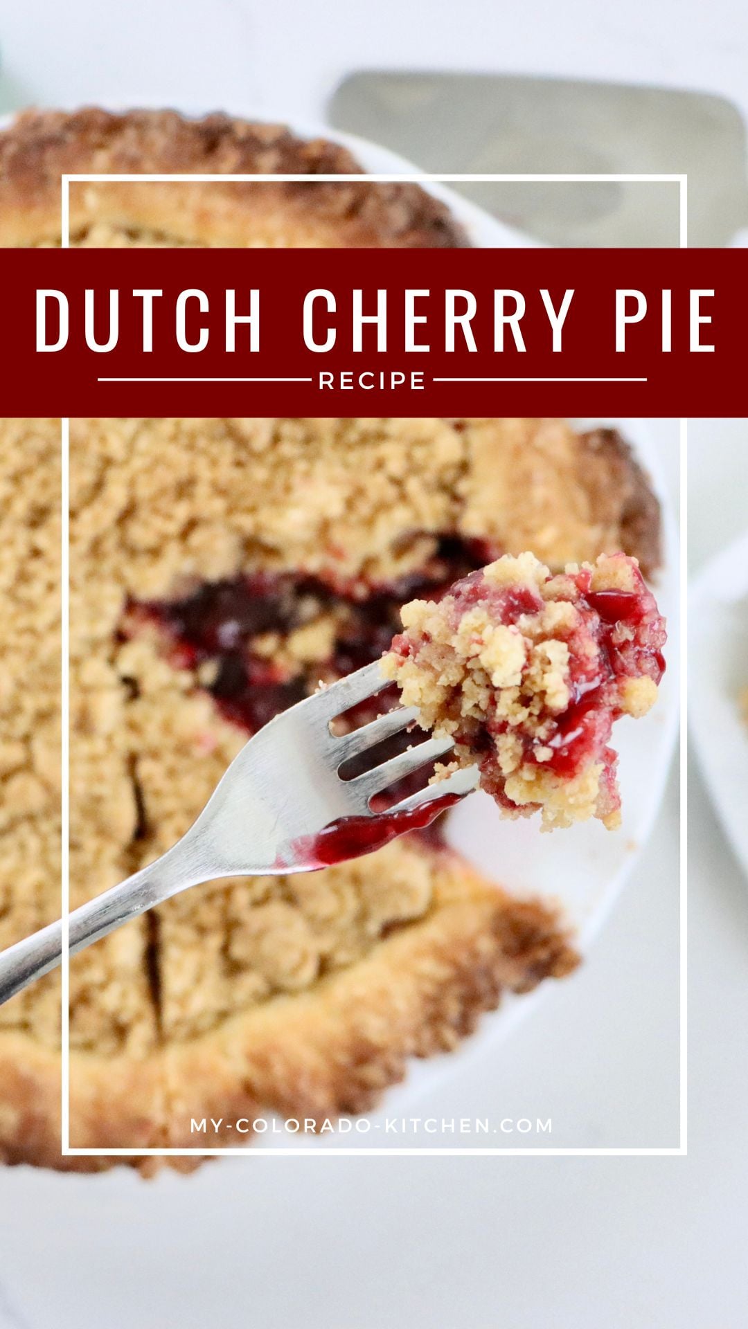 Golden Dutch Cherry Pie with buttery crumb topping, thick homemade cherry filling bubbling through, served in a white pie dish.