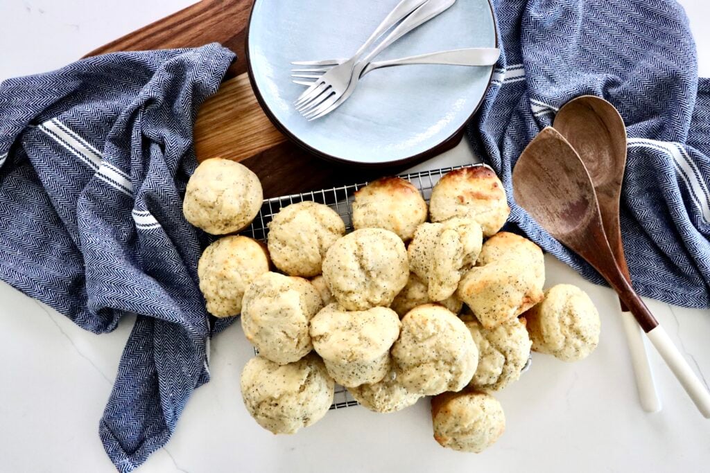Sourdough discard poppy seed muffins with tall bakery-style tops, soft and fluffy texture, made from scratch with real ingredients