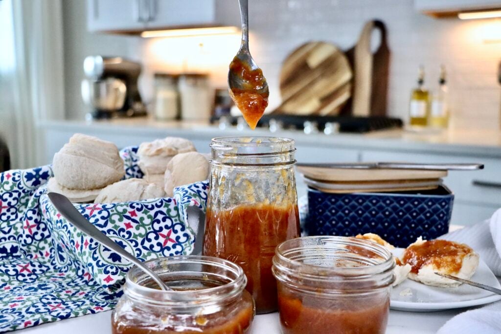 Small batch cinnamon peach jam in jars with warm spices and fresh peach flavor