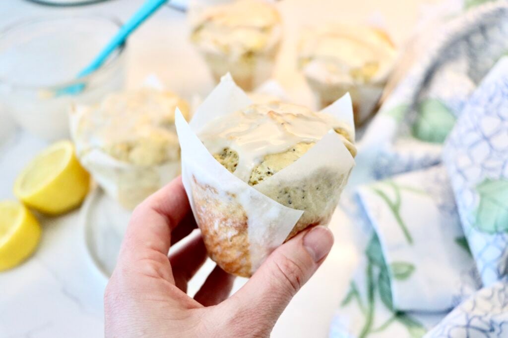 Bakery style sourdough lemon poppy seed muffins with fresh lemon zest and poppy seeds