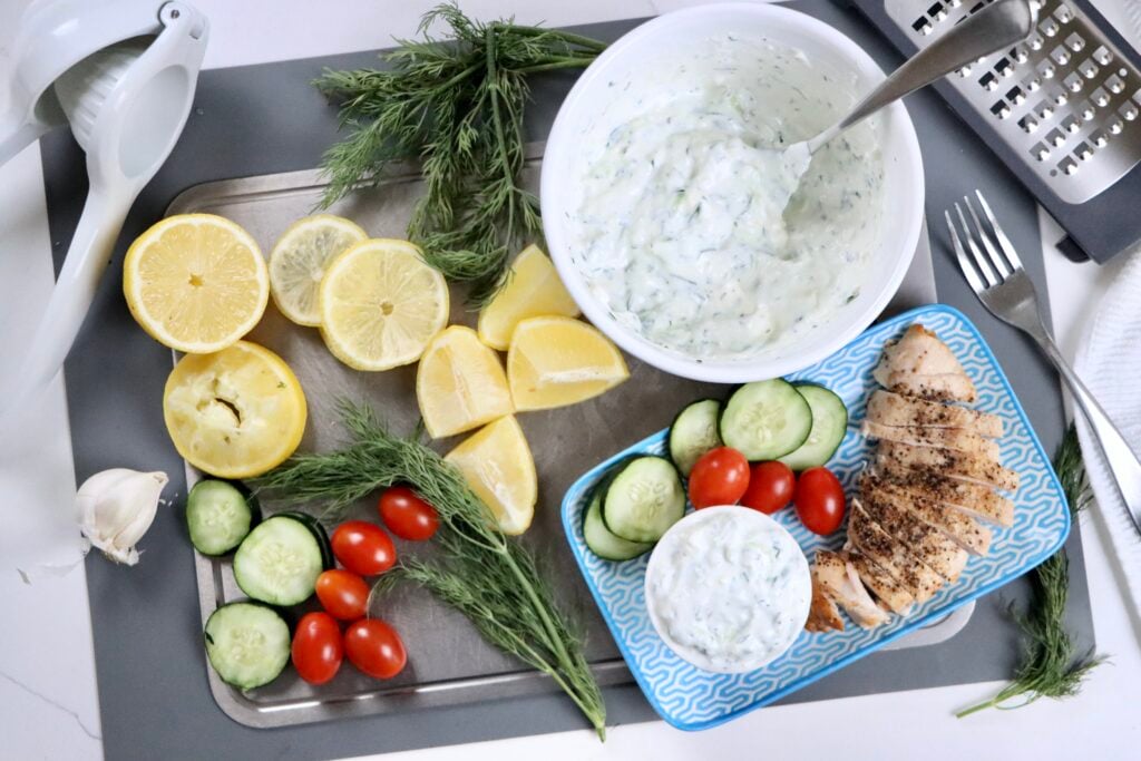 Creamy homemade tzatziki sauce made with Greek yogurt, cucumber, lemon, dill, and feta served in a bowl as a fresh healthy dip