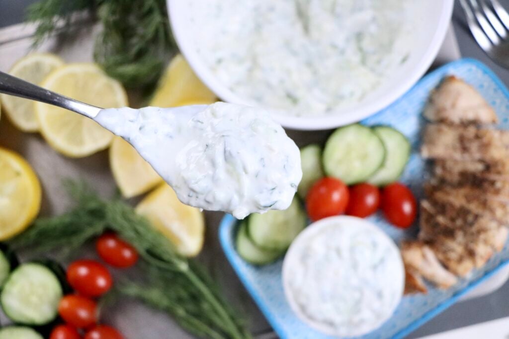 Close-up of thick and creamy tzatziki sauce showing Greek yogurt, shredded cucumber, garlic, and dill for a fresh homemade dip