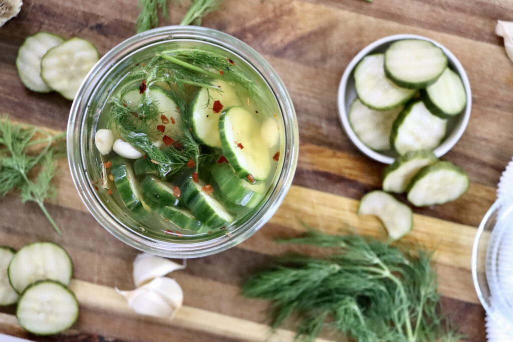 Close-up of crunchy dill pickles made from scratch with garlic, dill, and apple cider vinegar.