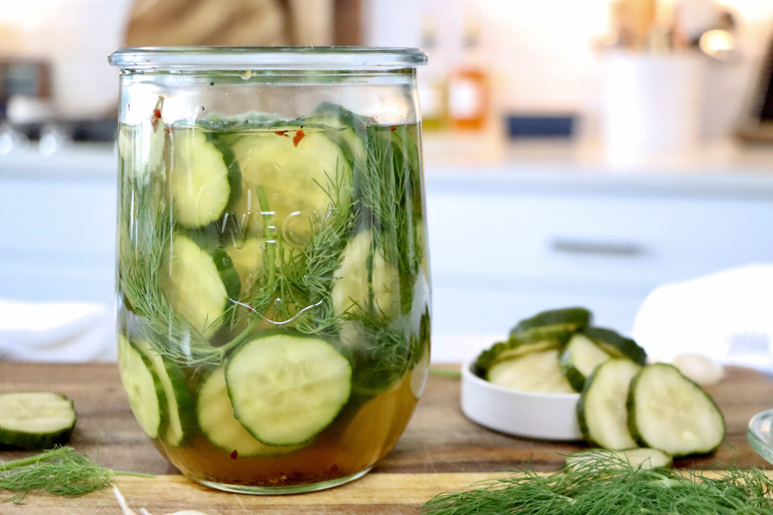 Healthy homemade pickles recipe with fresh cucumbers, garlic, dill, and natural vinegar brine.