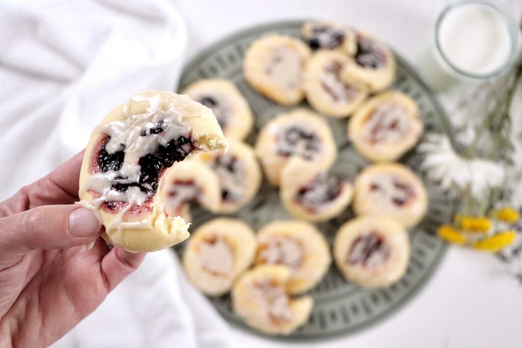 Close-up of soft homemade kolaches showing fluffy texture and sweet jam-filled centers