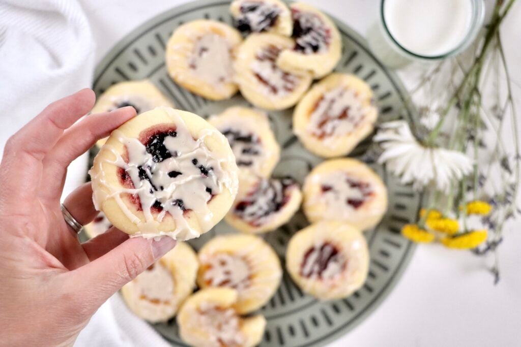 Fluffy homemade kolache pastries fresh from the oven with visible fruit jam centers