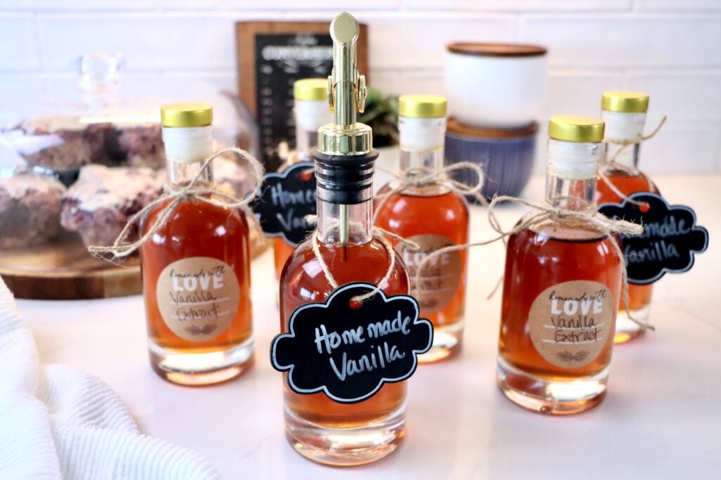Homemade vanilla extract made with vodka and whole vanilla beans in a glass bottle, simple DIY pantry staple recipe.