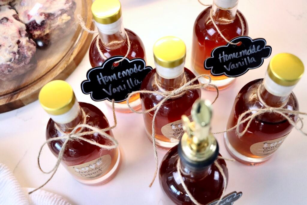 DIY vanilla extract in a glass bottle with vanilla beans, a simple from-scratch baking essential.