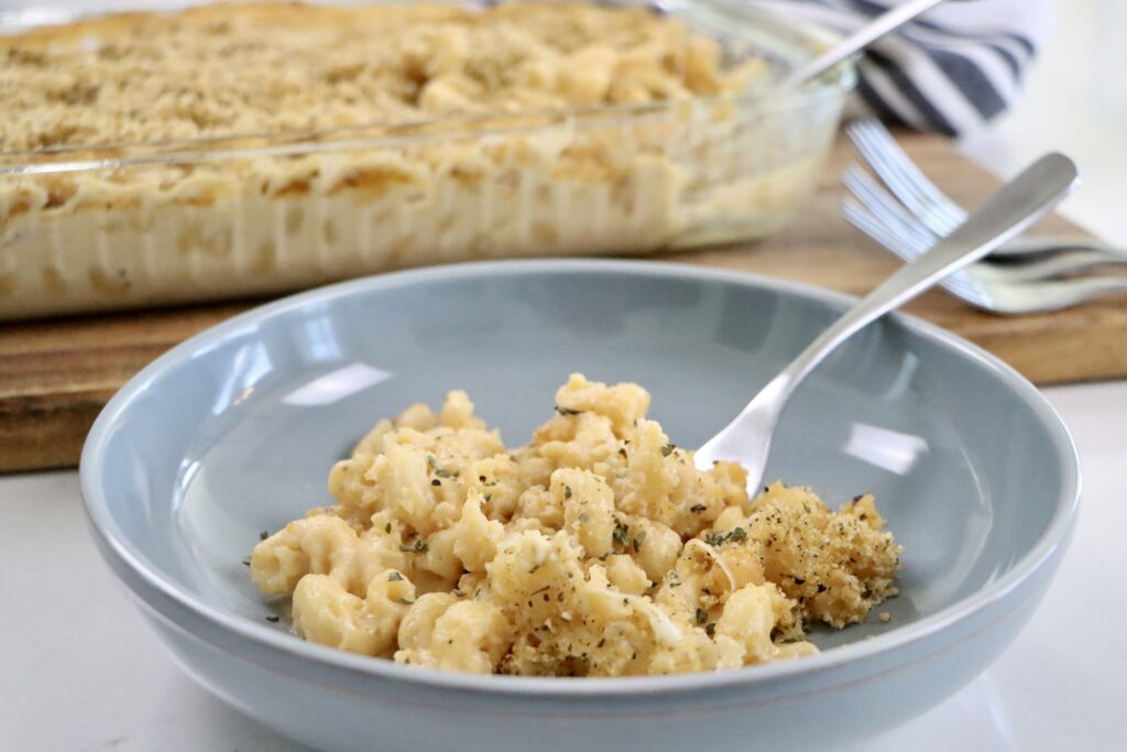 Golden brown baked macaroni and cheese with a creamy cheese sauce and crunchy breadcrumb topping.